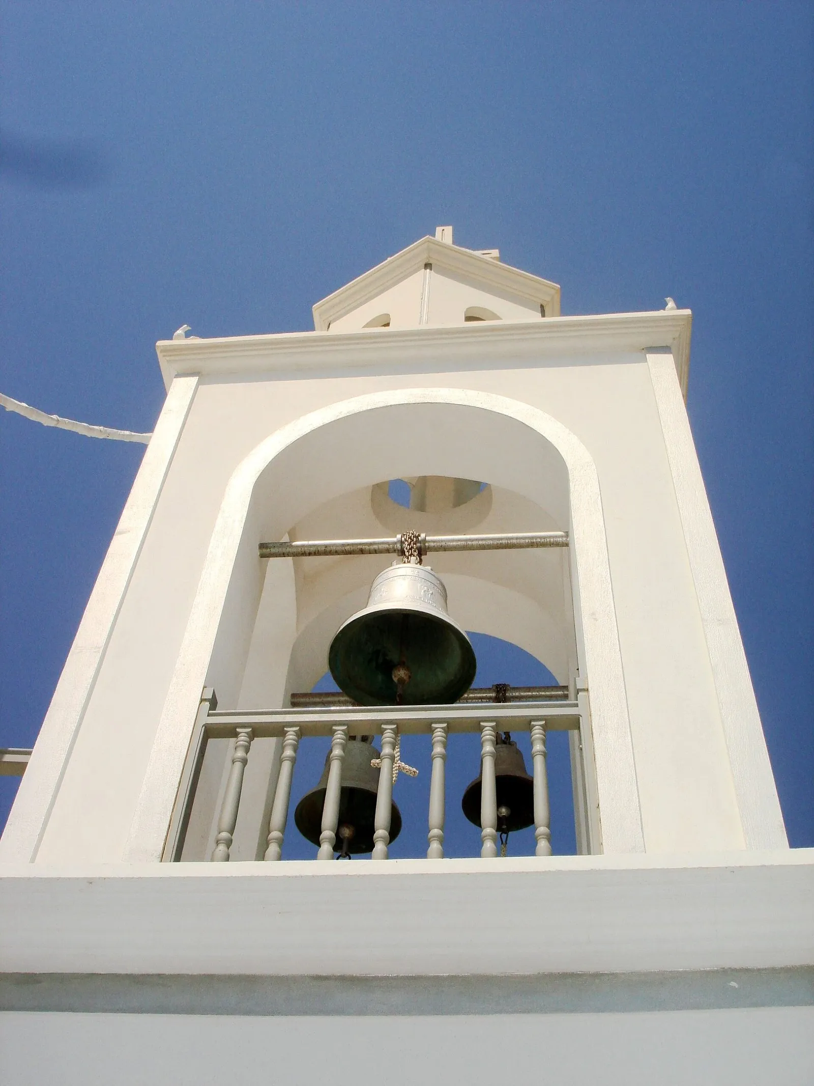 A whitewashed monastery bell tower on Nisyros